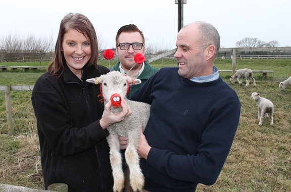 Puxton Park team with baby Red Nose lamb 